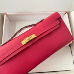 kelly cut 31 in cherry red calfskin with gold hardware