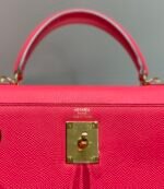 kelly 28cm in rose tyrien swift calfskin gold hardware