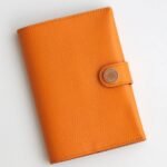 HERM R.M.S Passport Holder in Apricot Evercolor Calfskin