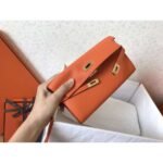 herm kelly classic long wallet in orange epsom leather