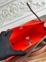 zip cabine 31 bag in fire orange canvas and bronze brown calfskin