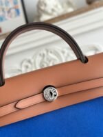 zip cabine 31 bag in cobalt blue canvas and bronze brown calfskin