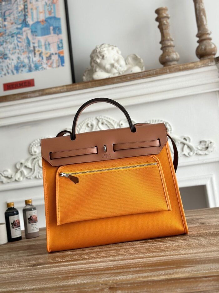 zip cabine 31 bag in apricot orange canvas and bronze brown calfskin