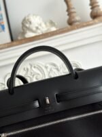 zip cabine 31 bag in black canvas and calfskin