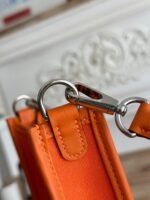 mini neo 17 evelyne bag in fire orange canvas and calfskin