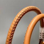 steeple 28 bag in off white h canvas and brown swift calfskin