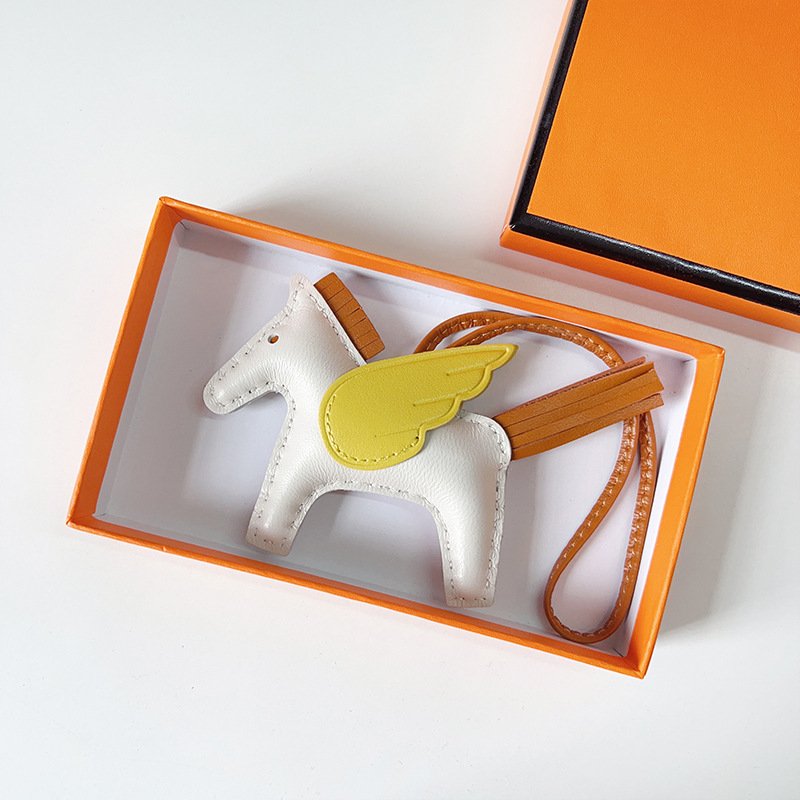 029FD69F-04DB-91F7-69D2-4BF135C12C35.jpg H Hand sewn pony pendant - Image 1