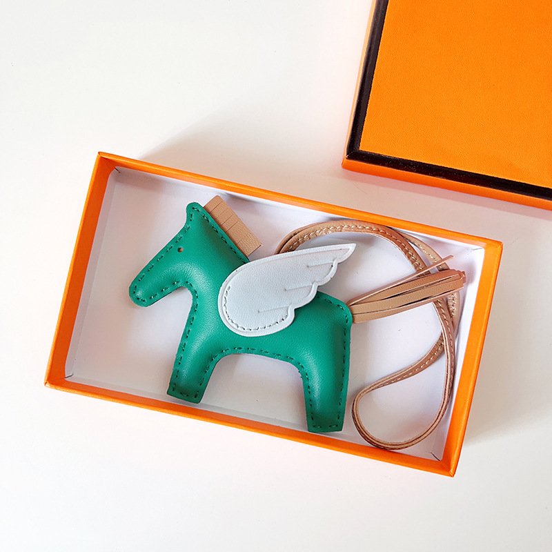 596E57F6-BE41-D5FA-253B-3B0BA5D16CFA.jpg H Hand sewn pony pendant - Image 1