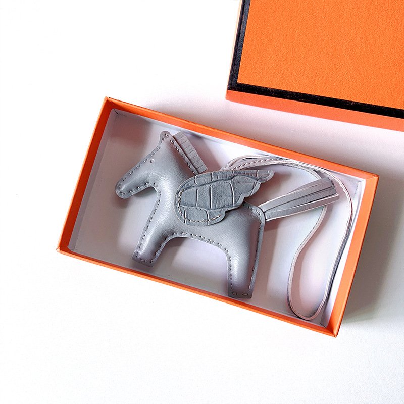 BBFD3122-869C-D050-3BD9-075F825D3EFA.jpg H Hand sewn pony pendant - Image 1