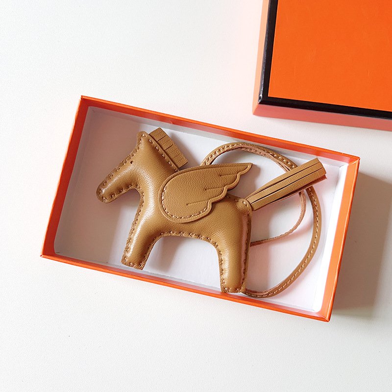 D98BC8EF-6766-6B1E-1BC7-E08440E169C0.jpg H Hand sewn pony pendant - Image 1